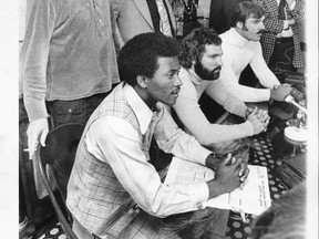 It was a media conference that rocked the sports world as (seated from foreground) receiver Paul Warfield and running backs Jim Kiick and Larry Csonka of the two-time Super Bowl champion Dolphins signed with the Toronto Northmen of the World Footvall League. Behind the trio are player agent Ed Keating and Northmen general manager Leo Cahill. (Postmedia)