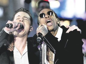 Wiz Khalifa, right, YouTube?s top video draw for See You Again with Charlie Puth, puts on a live show at Rock the Park on Thursday. (Special to Postmedia News)