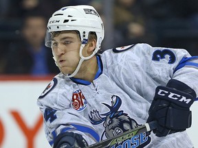 Manitoba Moose forward JC Lipon exhales after firing a shot against the Bakersfield Condors during AHL action in Winnipeg on Fri., Nov. 20, 2015. Moose open up the 2017-18 season on Oct. 6 against the Calder Cup champion Grand Rapids Griffins. Kevin King/Winnipeg Sun/Postmedia Network