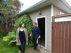 Kim Ziola wants to build a garage suite over his daughter, Tai Ziola's (left) garage but is worried changes passed by Edmonton's city council this week make wheelchair accessible units impossible to construct in Edmonton, July 11, 2017.