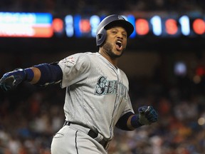 Robinson Cano of the Seattle Mariners and the American League celebrates hitting a home run in the tenth inning against the National League during the 88th MLB all-star game at Marlins Park on Tuesday. (Getty Images)