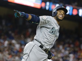 American League's Seattle Mariners Robinson Cano (22), rounds the bases after hitting a home run in the tenth inning, during the MLB baseball All-Star Game, Tuesday, July 11, 2017, in Miami. (AP Photo/Lynne Sladky)