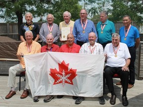 Players from the 1967 Canada Winter Games gold medal team, the Sarnia Drawbridge Inn Knights, held a reunion on June 22nd at Nick's Family Restaurant. The team is holding an original  1967 Canada Winter Games flag, procured by teammate Art Suzuki. Back row (from left to right): Peter Misikowetz, John Brikmanis, Doug Marshall, Doug Shaver, Dick Hames. Front row: Jerry Schen, Grant Gordon, Barry Howson, Barry Tremblay, Tom Henderson.
CARL HNATYSHYN/SARNIA THIS WEEK