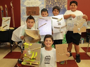 A group of Aamjiwnaang First Nation youth show off their handcrafted Rube Goldberg machines. Back row (left to right): Maddox Bois, Bryce Simon, Zach Riley and Dion Maness. Front: Jackson Antill. 
CARL HNATYSHYN/SARNIA THIS WEEK