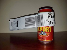 This handout photograph taken on July 8, 2017, and received on July 12 from Dean Stinson shows a can of beer with its baggage tag attached at the Perth Airport. (AFP PHOTO / DEAN STINSON)