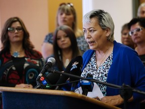 Sandra Delaronde, Missing and Murdered Indigenous Women and Girls (MMIWG) Coalition Co-chair, speaks at a press conference calling for a re-organization of the National Inquiry into Missing and Murdered Indigenous Women and Girls (MMIWG) in Winnipeg, Wednesday, July 12, 2017. THE CANADIAN PRESS/John Woods