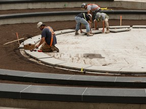 Workers are seen constructing the Aga Khan Garden's amphitheatre during a tour of the area at the University of Alberta Botanic Garden in Parkland County on Wednesday, July 12, 2017. Ian Kucerak / Postmedia