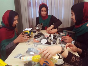 In this Thursday, July 6, 2017 photo, teenagers from the Afghanistan Robotic House, a private training institute, practice at the Better Idea Organization center, in Herat, Afghanistan. (AP Photos/Ahmad Seir)