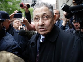 In this May 3, 2016 file photo, former New York Assembly Speaker Sheldon Silver is surrounded by media as he leaves the court in New York where he was sentenced to 12 years in prison on corruption charges.(AP Photo/Seth Wenig, File)