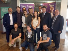 Sudbury MPP Glenn Thibeault, provincial finance minister Charles Sousa and Greater Sudbury mayor Brian Bigger join TimeHero Inc. staff for a photo following a press conference to announce more than $400,000 in funding through the NOHFC. Photo supplied
