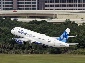In this Thursday, May 15, 2014, file photo, a JetBlue Airways Airbus A320-232 takes off from the Tampa International Airport in Tampa, Fla. JetBlue reports financial results Tuesday, July 26, 2016. (AP Photo/Chris O'Meara, File)