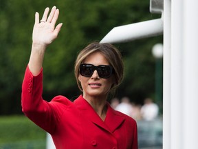 U.S. First Lady Melania Trump waves after a boat trip down the River Seine in Paris, Thursday, July 13, 2017. Donald Trump is in Paris for a high profile two-day visit during which US President will be the guest of honour of his French counterpart Emmanuel Macron at the annual Bastille Day parade. (AP Photo/Kamil Zihnioglu)