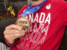 London's T.J. Sanders a member of Canada's national volleyball team shows off the bronze medal they won in a world league tournament in Brazil. Photograph taken on Wednesday July 12, 2017. (MIKE HENSEN, The London Free Press)