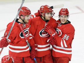 Carolina Hurricanes' Victor Rask is congratulated by teammates following a goal against the Montreal Canadiens during NHL action in Raleigh, N.C., on Nov. 18, 2016. (AP Photo/Gerry Broome)