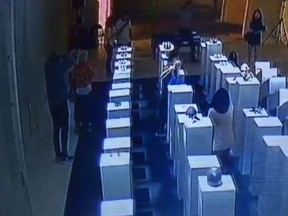 A woman taking in the Hypercaine art exhibit at the 14th Factory gallery in Los Angeles knocked over $200,000 worth of art while attempting to take a selfie. (YouTube screengrab)
