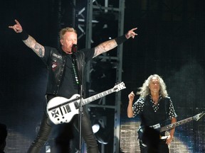 James Hetfield, left, and Kirk Hammett of the band Metallica perform in concert during their "WorldWired Tour" at M&T Bank Stadium on Wednesday, May 10, 2017, in Baltimore. (Owen Sweeney/Invision/AP)