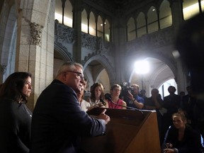 Ralph Goodale (right), Minister of Public Safety and Emergency Preparedness, and Jody Wilson-Raybould, Minister of Justice and Attorney General of Canada, hold a news conference regarding a $10.5 millon payment to Omar Khadr on Parliament Hill in Ottawa on Friday, July 7, 2017. THE CANADIAN PRESS/Fred Chartrand
