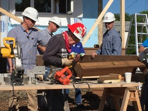 Former U.S. President Jimmy Carter builds steps for Habitat for Humanity at the Lyle Street construction site in St. James Thursday, July 13, 2017. Jason Friesen/Winnipeg Sun