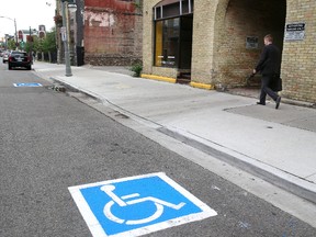 The city has added painted handicapped parking markers on roads for greater visibility. (MIKE HENSEN, The London Free Press)