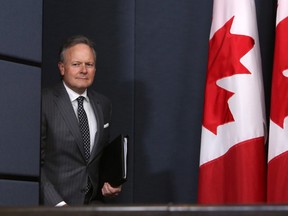 Stephen Poloz, Governor of the Bank of Canada makes his way to hold a news conference concerning the rise of the bank's interest rates, in Ottawa, Tuesday July 12, 2017. THE CANADIAN PRESS/Fred Chartrand