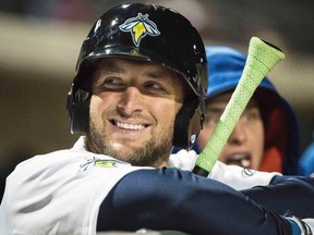 In April 6, 2017, file photo, Columbia Fireflies outfielder Tim Tebow smiles during a Class A minor league baseball game against the Augusta GreenJackets in Columbia, S.C. (AP Photo/Sean Rayford, File)
