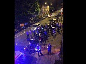 This is an image made available by Sarah Cobbold of the scene of an acid attack in London early Thursday July 13, 2017. Police said that five linked acid attacks by men on mopeds in London have left several people injured _ the latest in a spate of such crimes that have alarmed residents and politicians. The Metropolitan Police force says the 90-minute spree began late Thursday when Two men on a moped tossed a noxious substance into the face of a 32-year-old moped driver, then jumped on his vehicle and drove away. (Sarah Cobbold via AP)