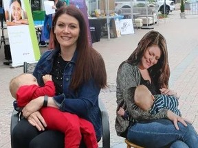 Holly Curtis sits beside a photo cut-out of herself Wednesday as she breastfed her son Lincoln in support of a new Porcupine Health Unit campaign in Timmins to promote breastfeeding. (Len Gillis/Postmedia Network)