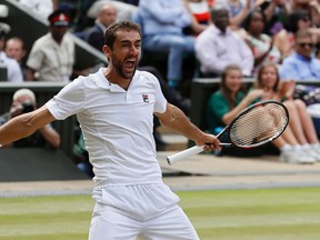 Marin Cilic celebrates after beating Sam Querrey at the Wimbledon Tennis Championships in London, Friday, July 14, 2017. (AP Photo/Kirsty Wigglesworth)