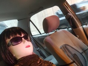 A mannequin in the seat of a vehicle stopped in an HOV lane on Hwy. 404 at Hwy. 401 on July 13, 2017. (OPP Sgt. Kerry Schmidt)