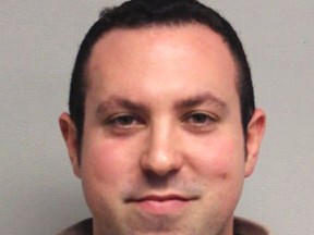 This booking photo released by the Portsmouth Police Department shows New Hampshire State Rep. Eric Schleien, R-Hudson, charged with sexually and physically assaulting a 16-year-old girl in 2016. (Portsmouth Police Department via AP)