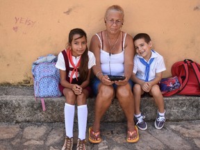A pleasure to meet siblings Melissa and Yonkiel after school with their ?abuela? grandmother in a quiet corner of the town square of the colonial town of Remedios in central Cuba. (BARBARA TAYLOR, The London Free Press)