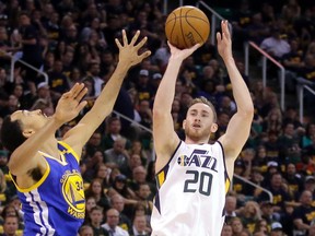In this May 6, 2017, file photo, Utah Jazz forward Gordon Hayward (20) shoots as Golden State Warriors guard Shaun Livingston (34) defends in the second half during Game 3 of the NBA basketball second-round playoff series in Salt Lake City. (AP Photo/Rick Bowmer, File)