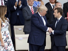 U.S President Donald Trump and his wife Melania Trump, French President Emmanuel Macron attend the traditional Bastille day military parade on the Champs-Elysees on July 14, 2017 in Paris France. Bastille Day, the French National day commemorates this year the 100th anniversary of the entry of the United States of America into World War I. (Photo by Thierry Chesnot/Getty Images)