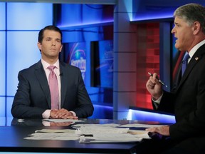 Donald Trump Jr., left, is interviewed by host Sean Hannity on his Fox News Channel television program, in New York Tuesday, July 11, 2017. (AP Photo/Richard Drew)