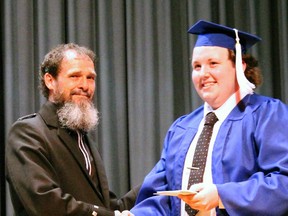 Bob Ellison (left) dressed formally in his kilt for special occasions while at Mitchell District High School (MDHS), proud of his Scottish heritage. Here he presents MDHS graduate Jim Tubb with an award at the school’s recent Commencement ceremony. SUBMITTED