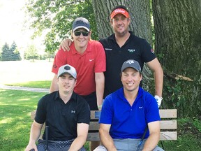 Mitchell residents Tyler Tolton (back, left), Mike Feltz, Bryan Stacey (bottom, left) and Kyle Verberne take a break during the Mitchell Golf & Country Club’s men’s invitational tournament July 7. SUBMITTED