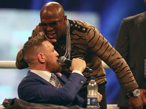 Floyd Mayweather Jr. and Conor McGregor trade insults during their World Press Tour at SSE Arena on July 14, 2017 in London. (Matthew Lewis/Getty Images)