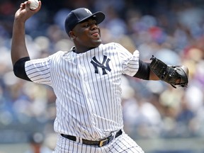 New York Yankees starting pitcher Michael Pineda winds up for a pitch during the first inning of a baseball game against the Toronto Blue Jays in New York, Wednesday, July 5, 2017. (AP Photo/Kathy Willens)