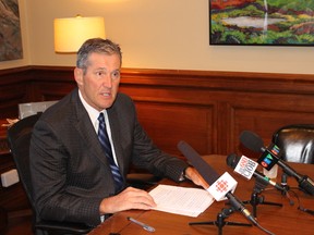 Premier Brian Pallister talks to reporters in Winnipeg on Friday, July 14, 2017. JOYANNE PURSAGA/Winnipeg Sun/Postmedia Network