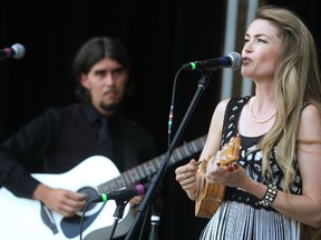 Photos by Mike Hensen/The London Free Press
The Married?s Kevin Kennedy and Jane Carmichael perform on the main stage during the first day of the Home County Music and Art Festival Friday.