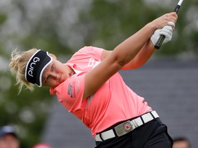 Brooke Henderson of Smiths Falls tees off on the first hole during the second round of the U.S. Women's Open golf tournament on Friday in Bedminster, N.J. U.S. President Donald Trump arrived on the scene later in the round.