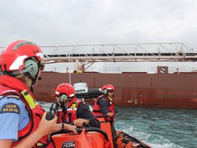 Shown is the crew of Inshore Rescue Boat 1001, including coxswain Kayla Graham with crew members Ben St. Peters and Stuart Thibert hailing a ship in the St. Clair River. Jeremiah Rodriguez/Postmedia Network