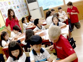Students from Lambton Kent District School Board help out in a Korean classroom. (Courtesy of Stef Wood)