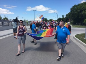 Co-chairs of Steinbach Pride, Michelle McHale (left) and Chris Plett lead the second annual Steinbach Pride Parade on Saturday, July 15, 2017. Hundreds of Manitobans headed to Steinbach in southeastern Manitoba, 63 kms from Winnipeg, to show their support of the LGBTTQ community. JASON FRIESEN/Winnipeg Sun/Postmedia Network