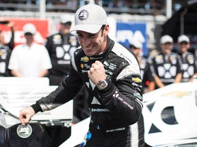 French driver Simon Pagenaud celebrates taking pole position during the qualifying session for the Honda Indy Toronto on Saturday, July 15, 2017. (THE CANADIAN PRESS/Chris Young)