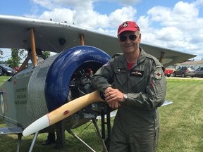 Pilot Allan Snowie with his replica Vimy bi-plane. The open air planes have a three hour gas tank and are as similar as possible to the ones flown during the First World War. (Jennifer Bieman/London Free Press)