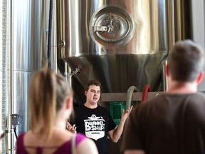 Head brewer Taylor Falk giving a tour at the Yellowhead Brewery which is part of a five brewery tour people paid for in Edmonton, July 15, 2017. Ed Kaiser/Postmedia