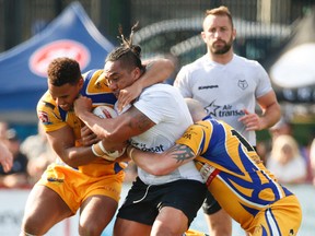 Toronto Wolfpack Fuifui Moimoi drags three Hemel Stags players down the field during the second  half of the English rugby league Kingstone Press League 1  in Toronto, Ont. on Saturday July 15, 2017. Jack Boland/Toronto Sun/Postmedia Network