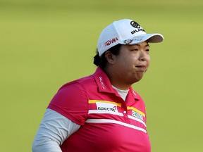 Shanshan Feng of China smiles after her putt on the 18th green during the U.S. Women's Open round three on July 15, 2017 at Trump National Golf Club in Bedminster, New Jersey. (Elsa/Getty Images)