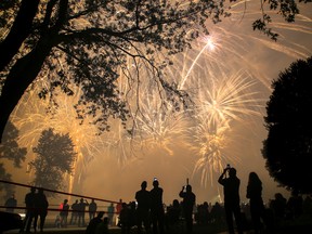 Watchers in Centennial Park hold up cell phones to record the finale of a fireworks display put on by Mystical Distributing on  Friday July 14, 2017 in Trenton, Ont. Tim Miller/Belleville Intelligencer/Postmedia Network